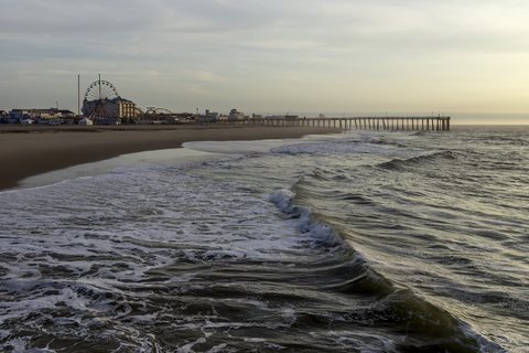 The beach and the pier at dawn in Ocean City, Maryland